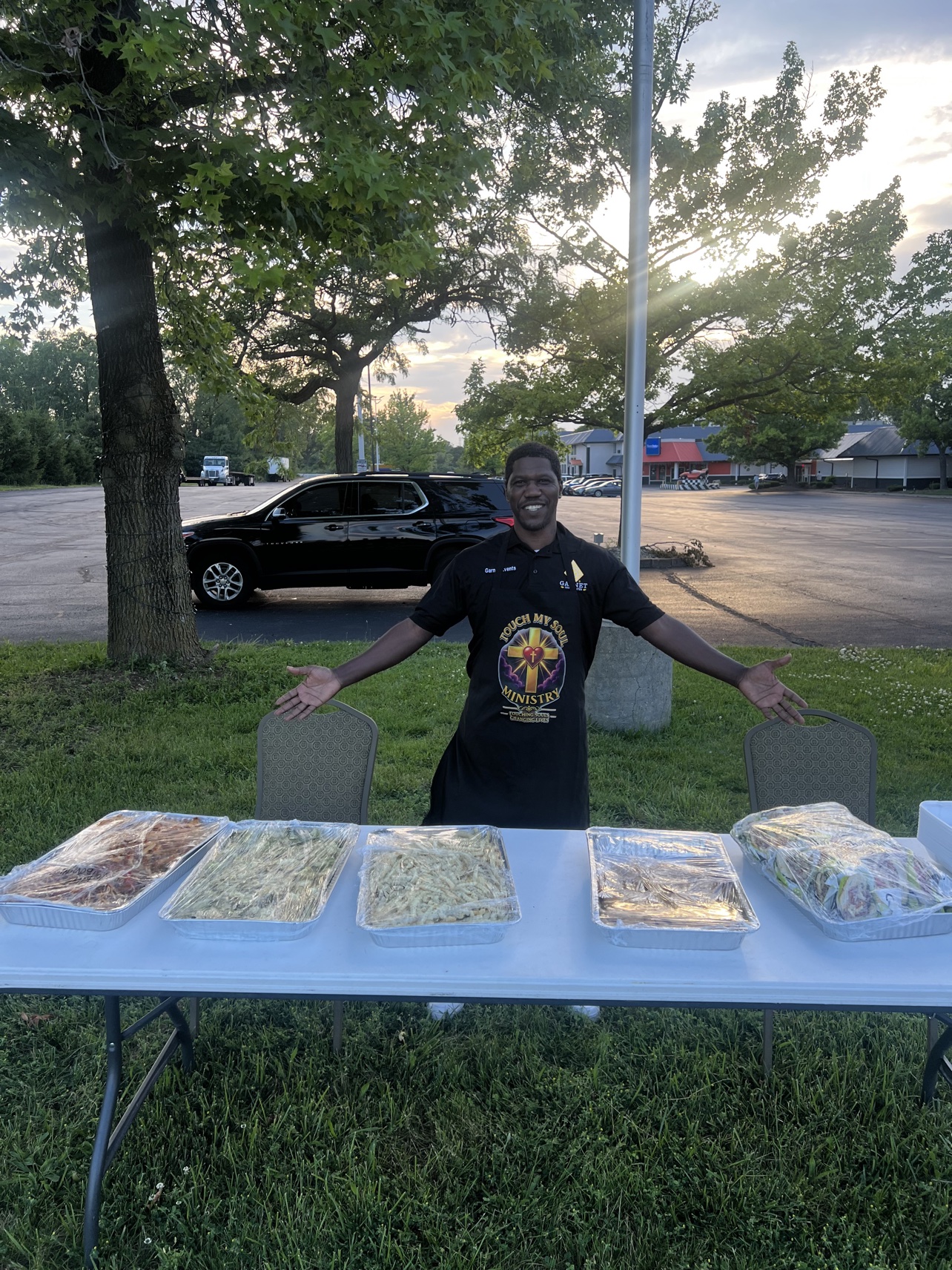Serving food to neighbors at a community outreach