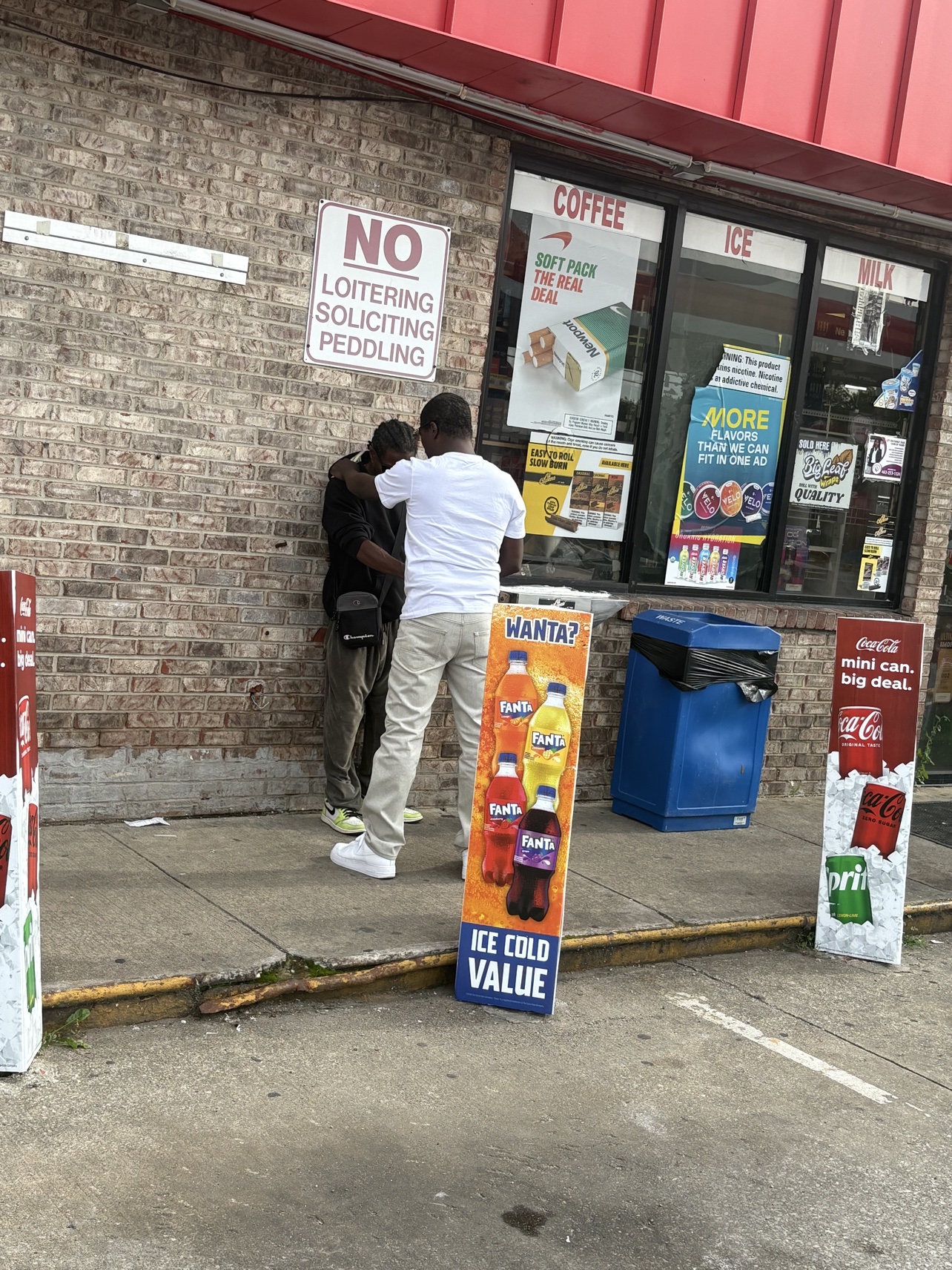Praying with community members during street outreach
